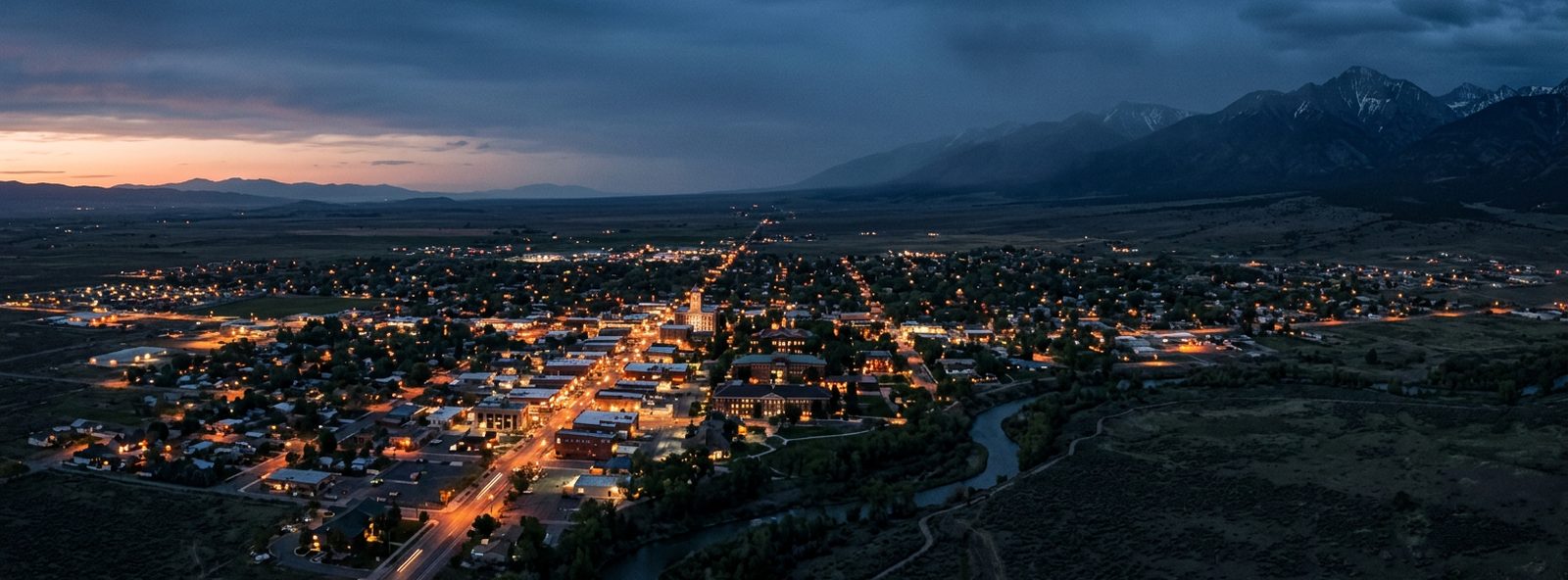 Aerial view of the Alamosa, Colorado skyline at dusk, illustrating the metro area TactStack serves trade and service businesses in