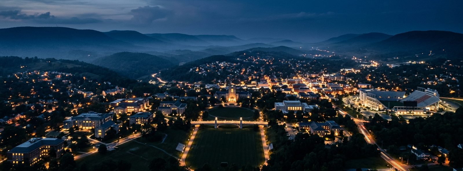 Aerial view of the Blacksburg, Virginia skyline at dusk, illustrating the metro area TactStack serves trade and service businesses in