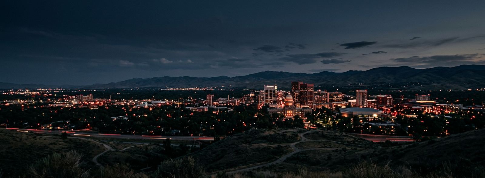 Aerial view of the Boise, Idaho skyline at dusk, illustrating the metro area TactStack serves trade and service businesses in