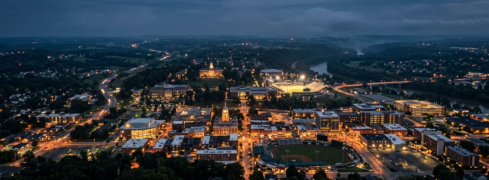 Aerial view of the Bowling Green, Kentucky skyline at dusk, illustrating the metro area TactStack serves trade and service businesses in