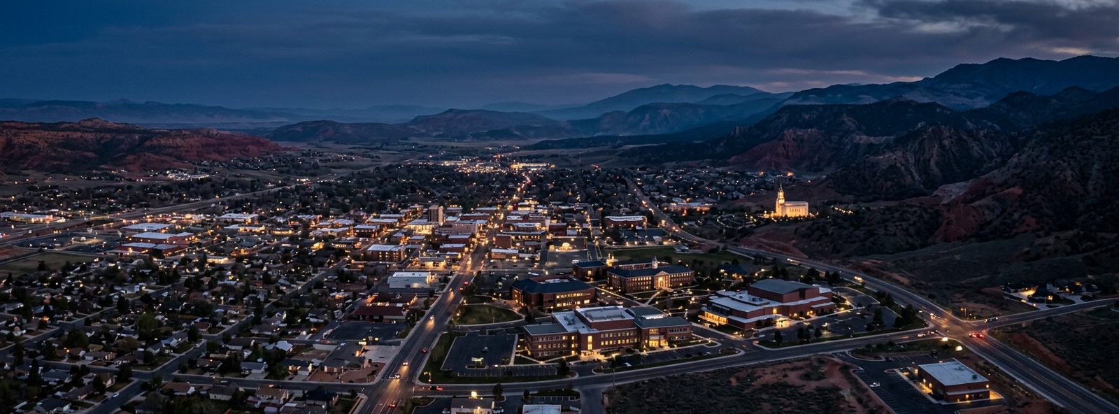 Aerial view of the Cedar City, Utah skyline at dusk, illustrating the metro area TactStack serves trade and service businesses in