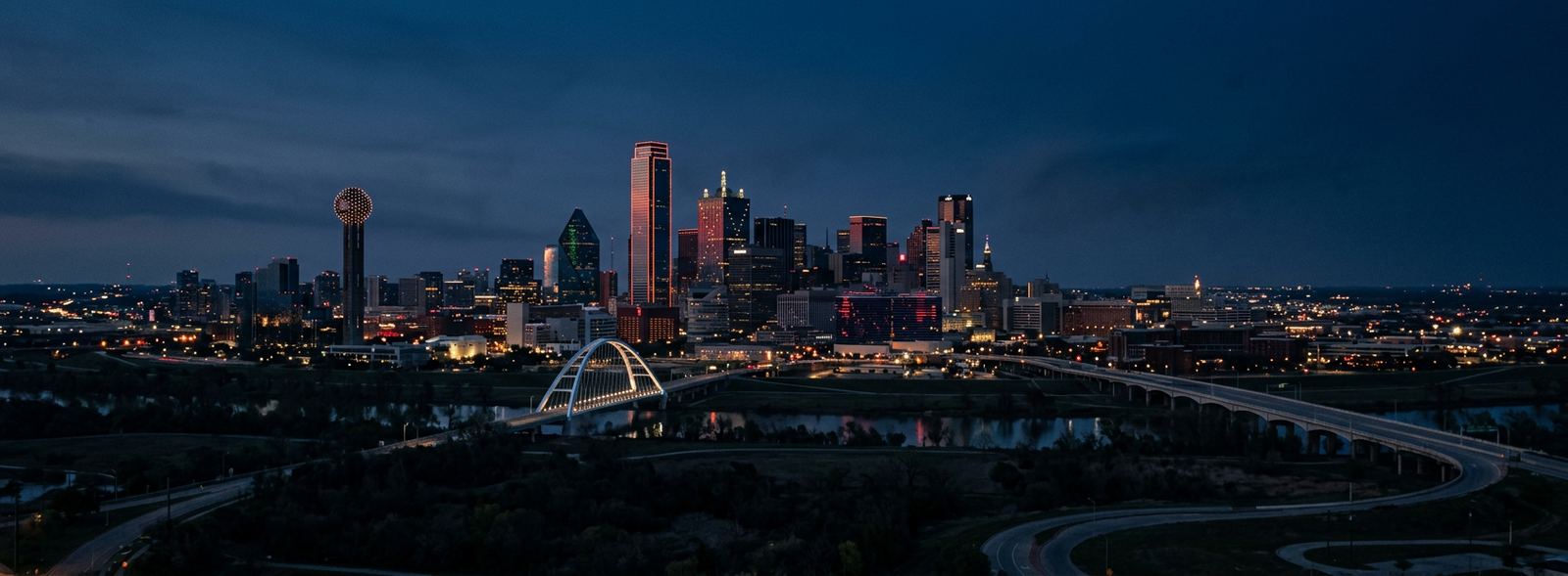 Aerial view of the Dallas, Texas skyline at dusk, illustrating the metro area TactStack serves trade and service businesses in