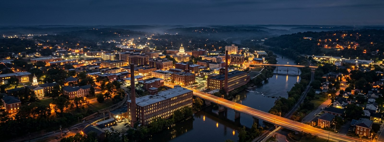 Aerial view of the Danville, Virginia skyline at dusk, illustrating the metro area TactStack serves trade and service businesses in