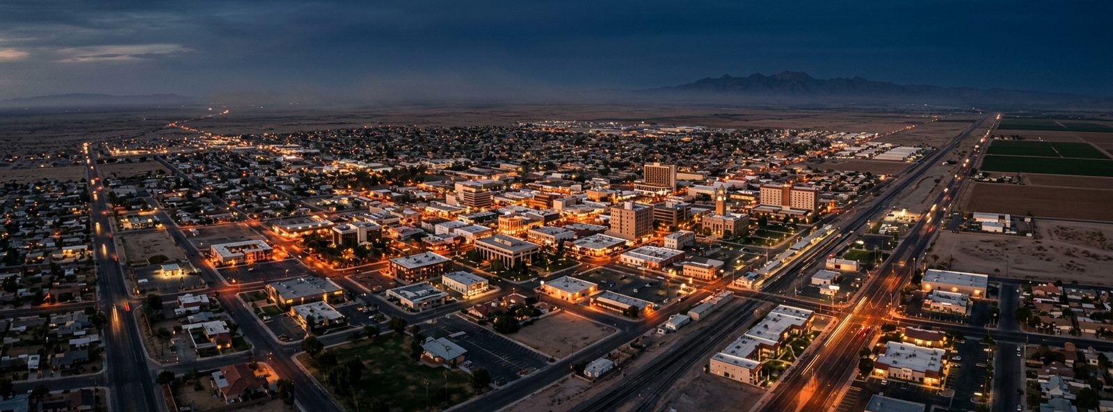 Aerial view of the El Centro, California skyline at dusk, illustrating the metro area TactStack serves trade and service businesses in