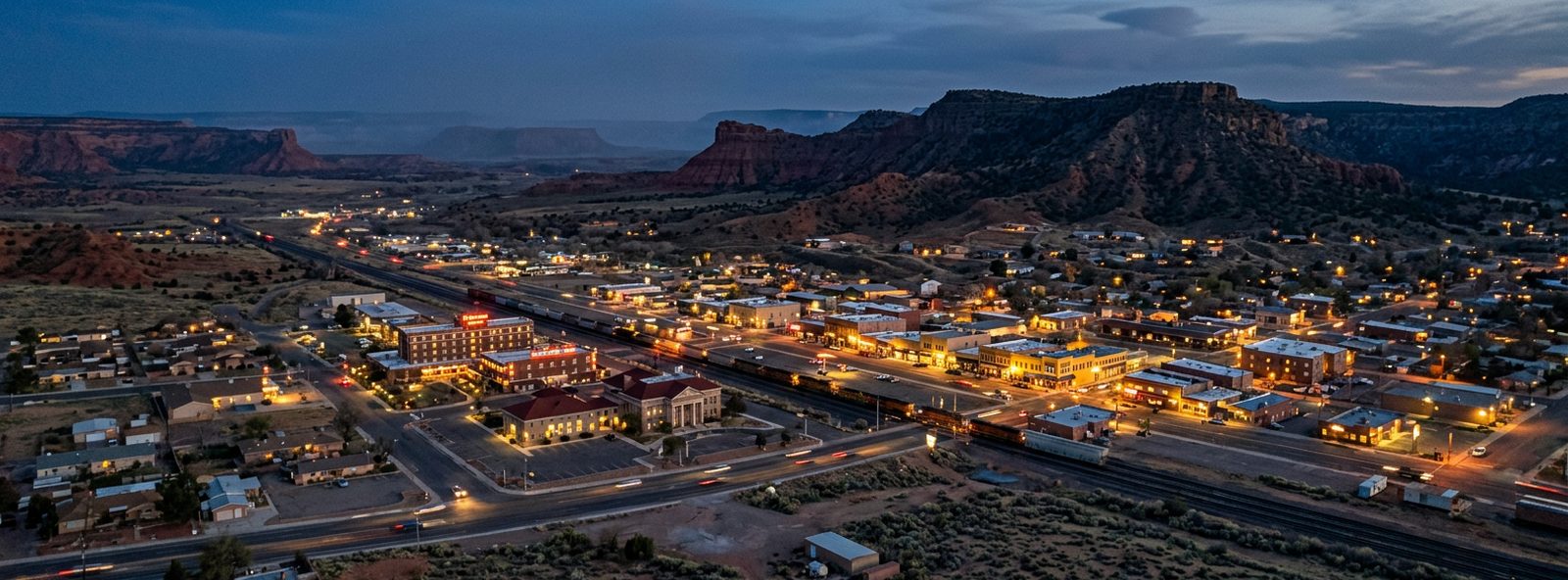 Aerial view of the Gallup, New Mexico skyline at dusk, illustrating the metro area TactStack serves trade and service businesses in
