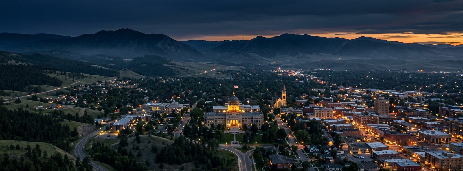 Aerial view of the Helena, Montana skyline at dusk, illustrating the metro area TactStack serves trade and service businesses in