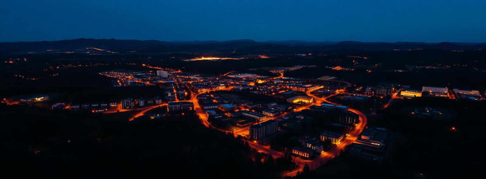 Aerial view of the Hickory, North Carolina skyline at dusk, illustrating the metro area TactStack serves trade and service businesses in