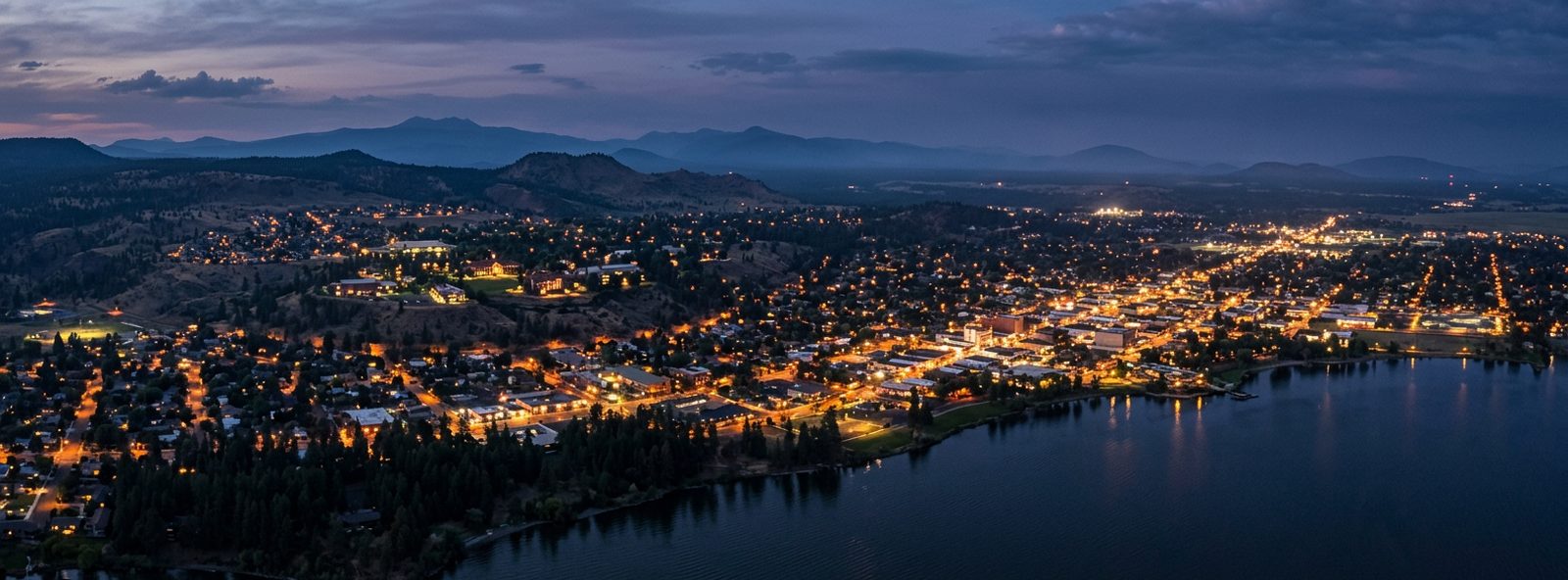 Aerial view of the Klamath Falls, Oregon skyline at dusk, illustrating the metro area TactStack serves trade and service businesses in