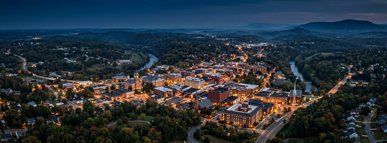 Aerial view of the Martinsville, Virginia skyline at dusk, illustrating the metro area TactStack serves trade and service businesses in
