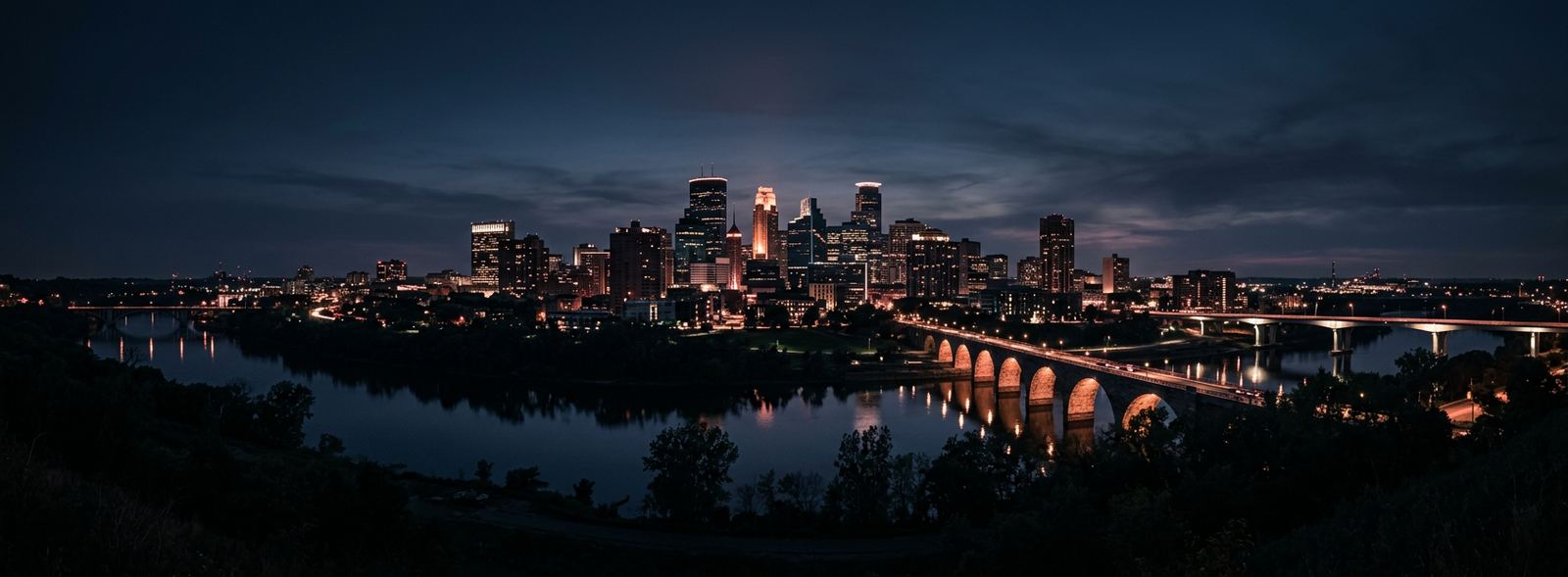 Aerial view of the Minneapolis, Minnesota skyline at dusk, illustrating the metro area TactStack serves trade and service businesses in