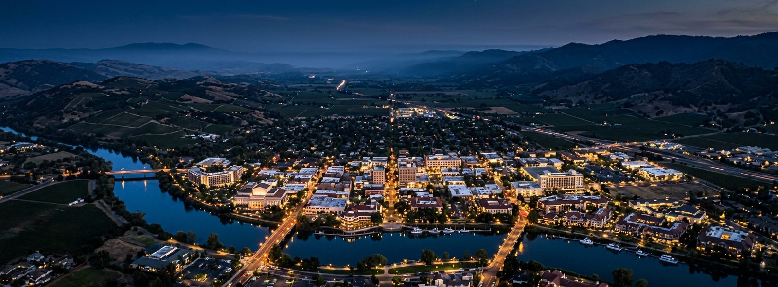 Aerial view of the Napa, California skyline at dusk, illustrating the metro area TactStack serves trade and service businesses in