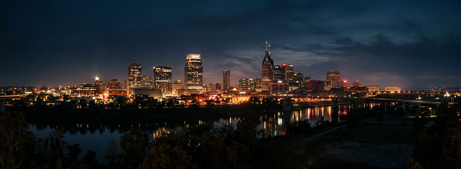 Aerial view of the Nashville, Tennessee skyline at dusk, illustrating the metro area TactStack serves trade and service businesses in