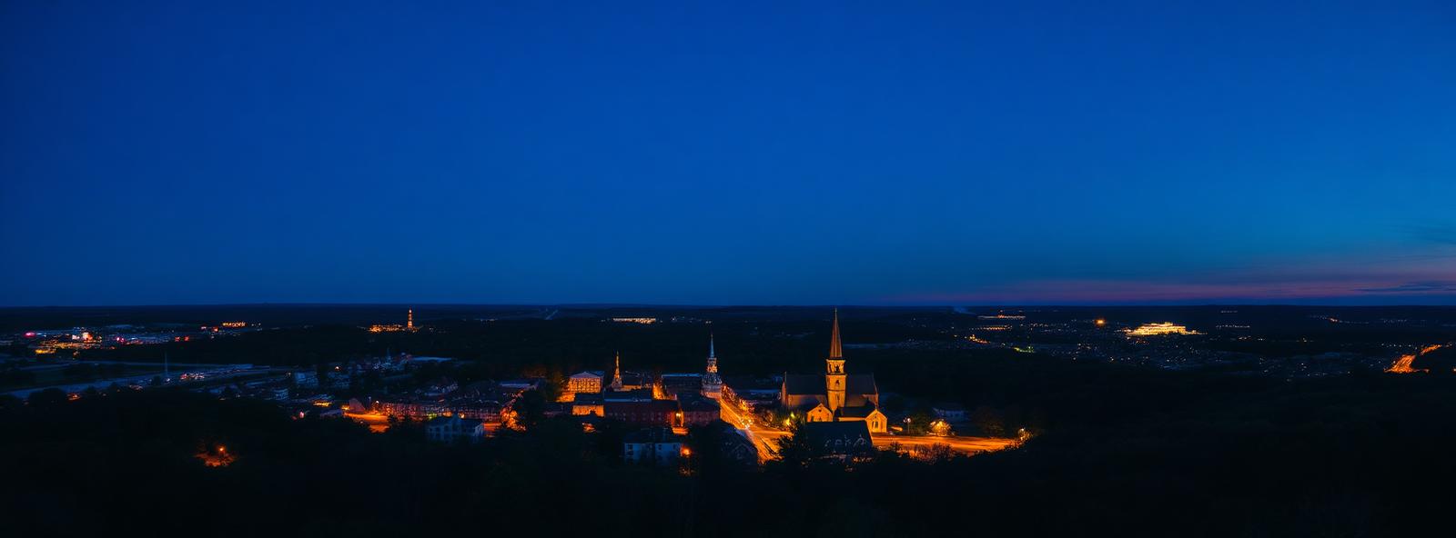 Aerial view of the Norwich, Connecticut skyline at dusk, illustrating the metro area TactStack serves trade and service businesses in