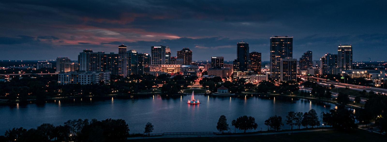 Aerial view of the Orlando, Florida skyline at dusk, illustrating the metro area TactStack serves trade and service businesses in