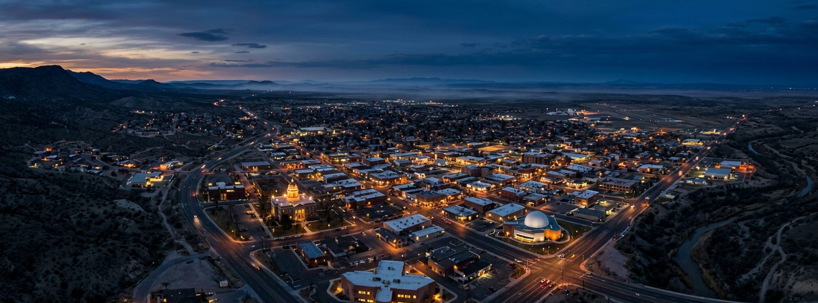 Aerial view of the Roswell, New Mexico skyline at dusk, illustrating the metro area TactStack serves trade and service businesses in
