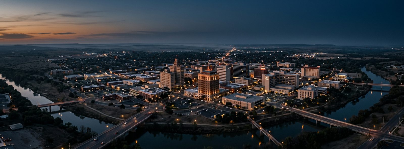 Aerial view of the San Angelo, Texas skyline at dusk, illustrating the metro area TactStack serves trade and service businesses in