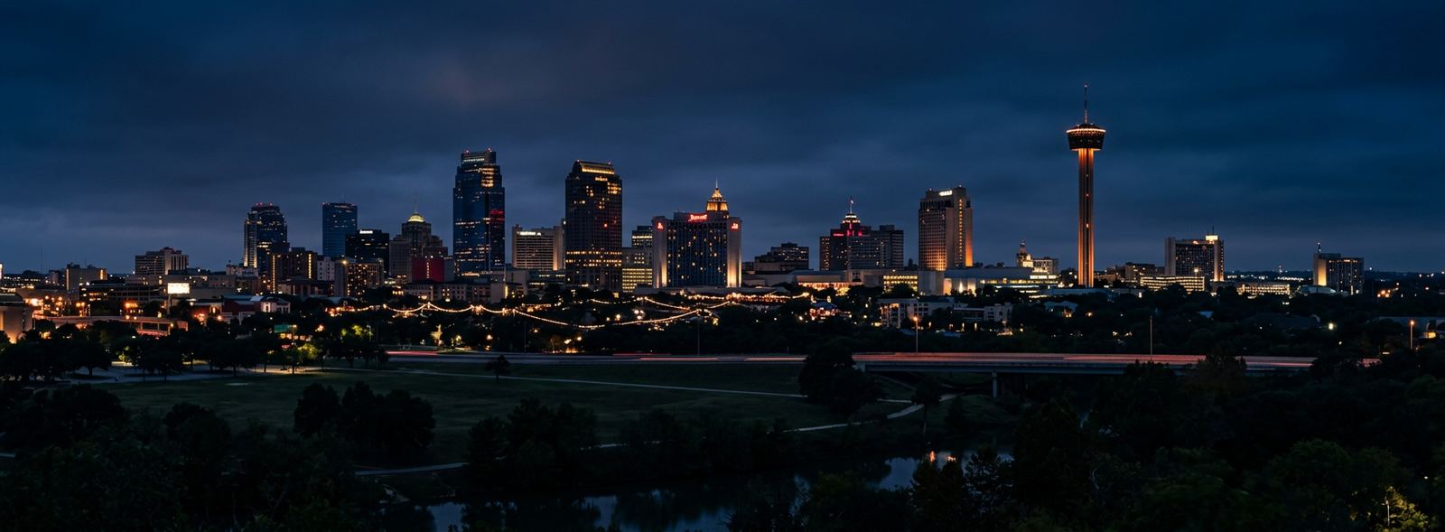 Aerial view of the San Antonio, Texas skyline at dusk, illustrating the metro area TactStack serves trade and service businesses in