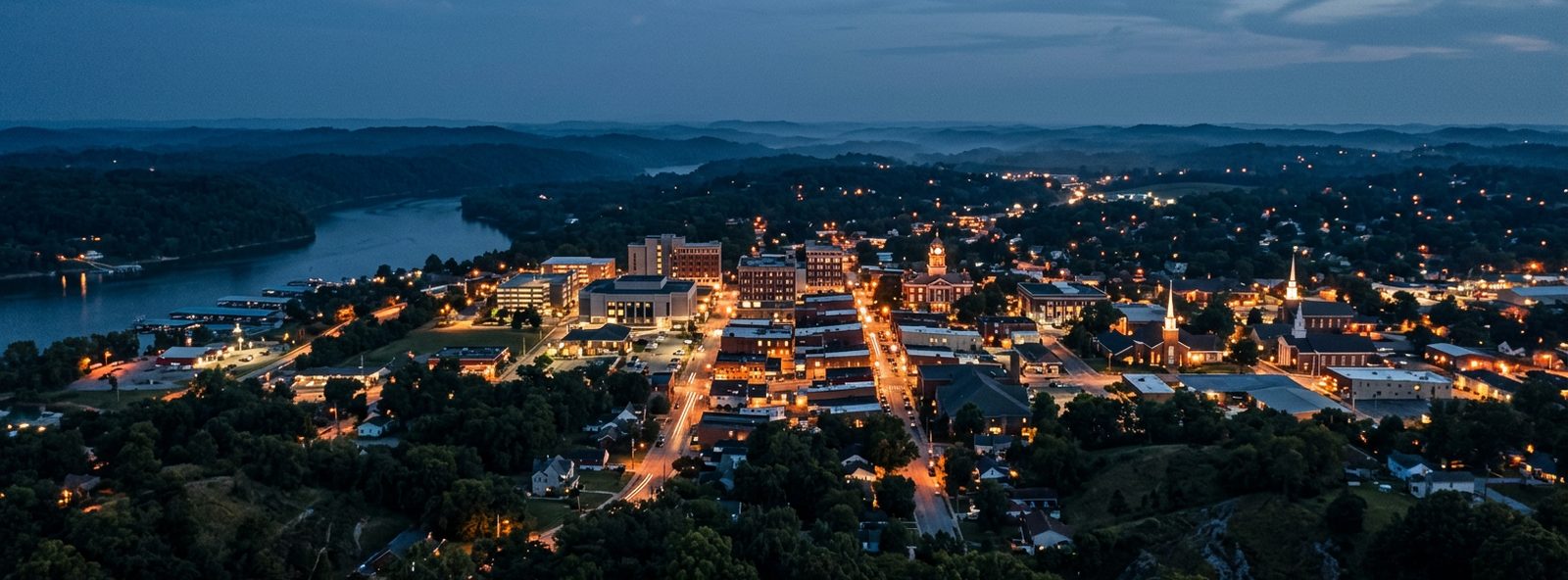 Aerial view of the Somerset, Kentucky skyline at dusk, illustrating the metro area TactStack serves trade and service businesses in