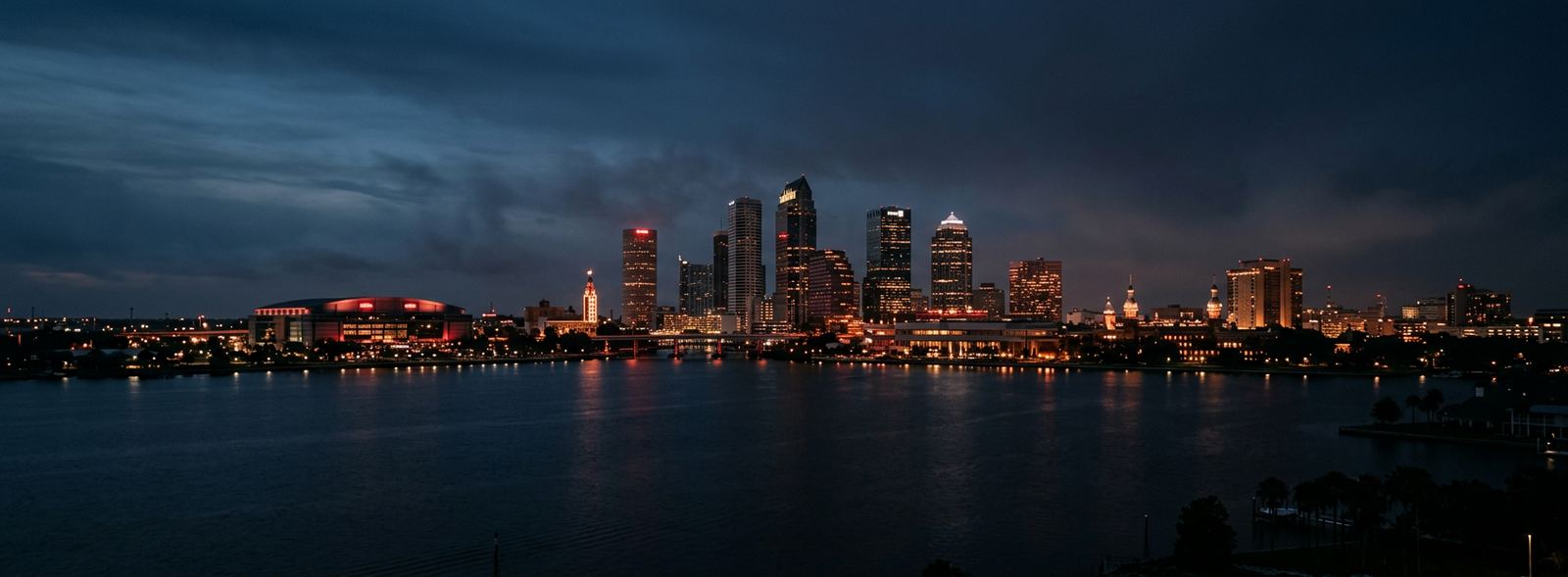 Aerial view of the Tampa, Florida skyline at dusk, illustrating the metro area TactStack serves trade and service businesses in